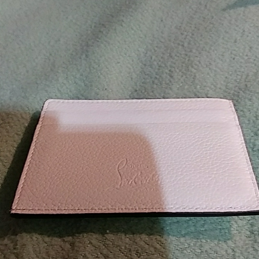 White spiked Christian Louboutin wallet